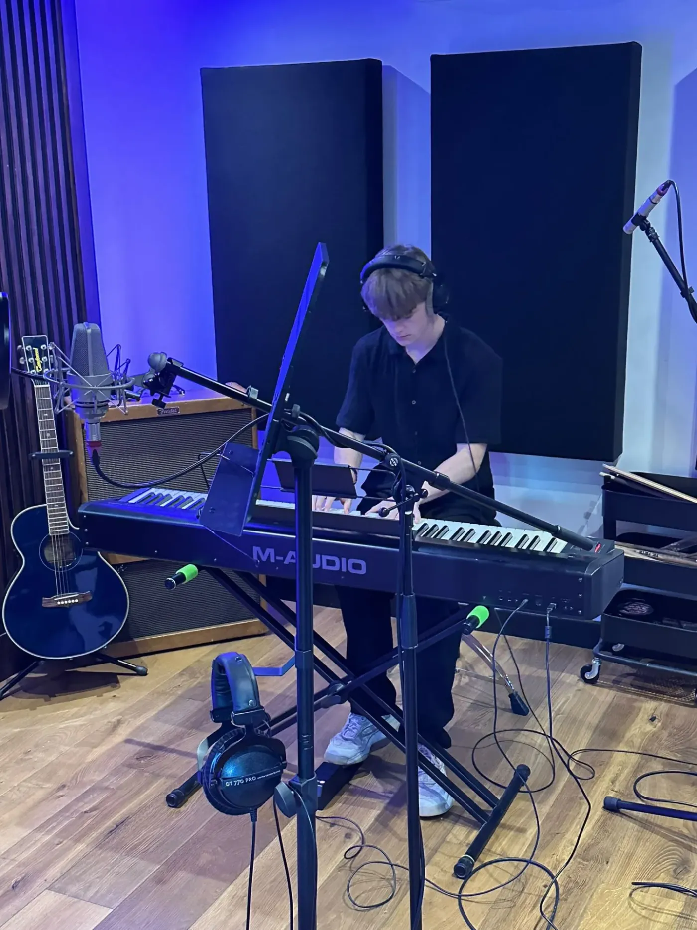 Jack Morgan playing a stage piano in a recording studio